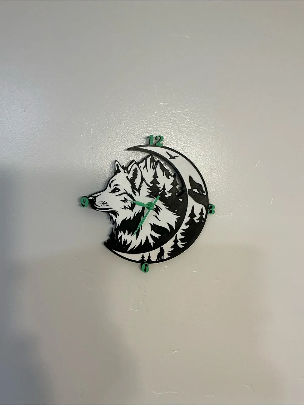 Wolf Moon Black and White Wall Clock with Green Accents